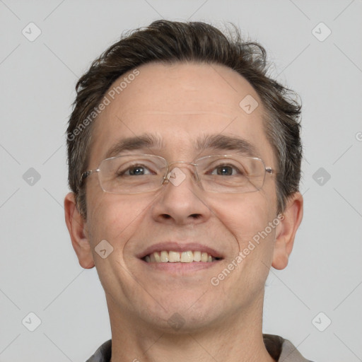 Joyful white adult male with short  brown hair and grey eyes