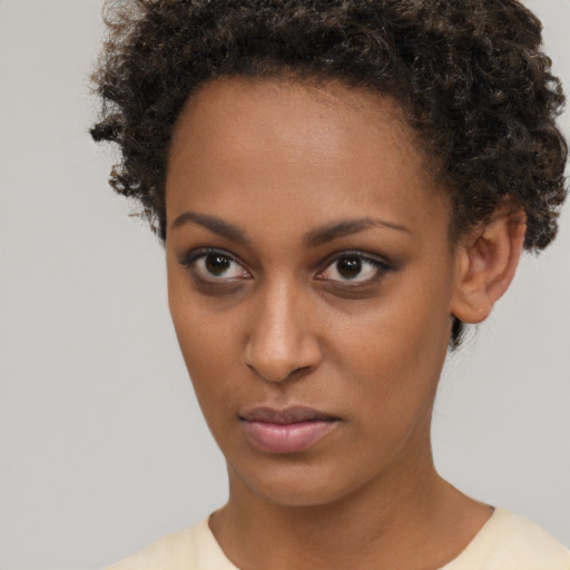Neutral black young-adult female with short  brown hair and brown eyes