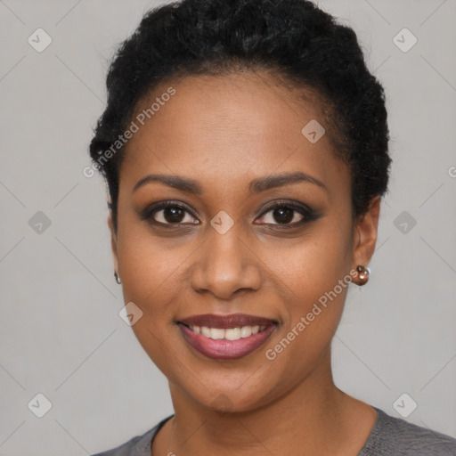 Joyful black young-adult female with short  brown hair and brown eyes