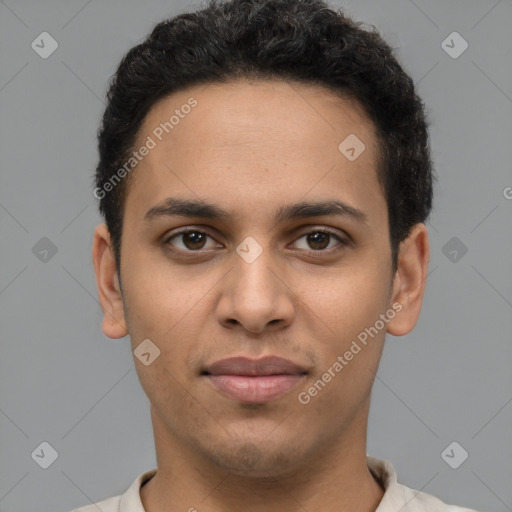 Joyful latino young-adult male with short  brown hair and brown eyes