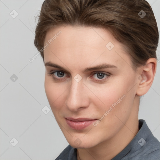 Joyful white young-adult female with short  brown hair and grey eyes