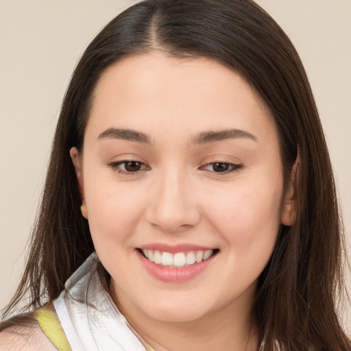 Joyful white young-adult female with long  brown hair and brown eyes