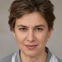 Joyful white adult female with short  brown hair and brown eyes