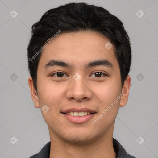 Joyful asian young-adult male with short  black hair and brown eyes