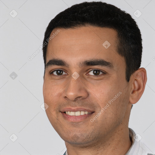 Joyful white young-adult male with short  black hair and brown eyes