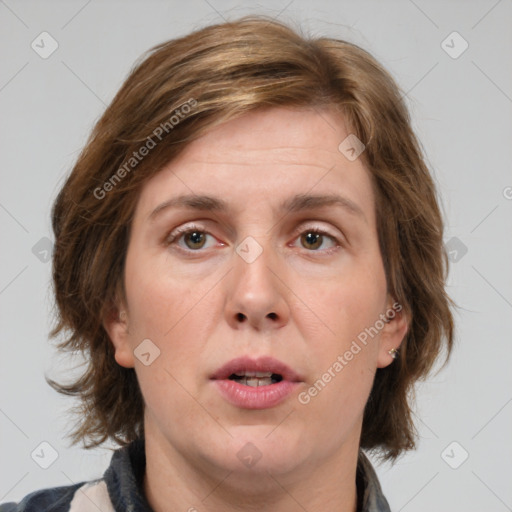 Joyful white adult female with medium  brown hair and green eyes