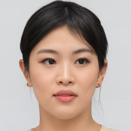 Neutral asian young-adult female with medium  brown hair and brown eyes