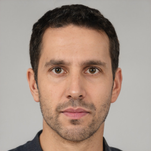 Neutral white adult male with short  black hair and brown eyes