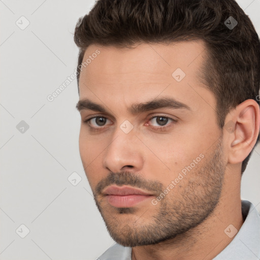 Neutral white young-adult male with short  brown hair and brown eyes