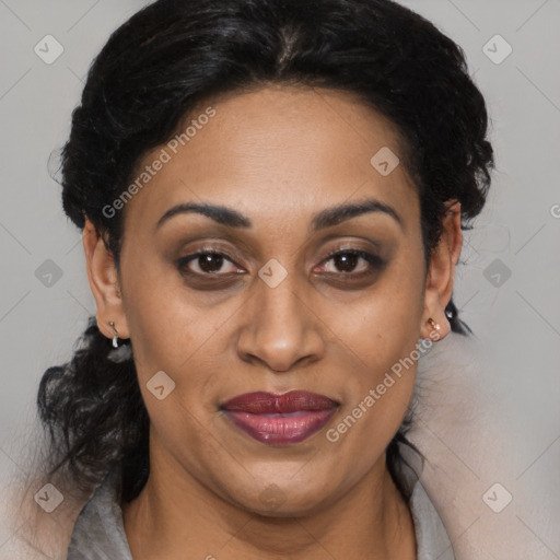 Joyful latino adult female with medium  brown hair and brown eyes