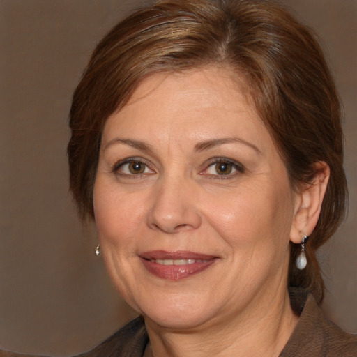 Joyful white adult female with medium  brown hair and brown eyes