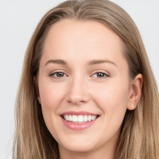 Joyful white young-adult female with long  brown hair and grey eyes