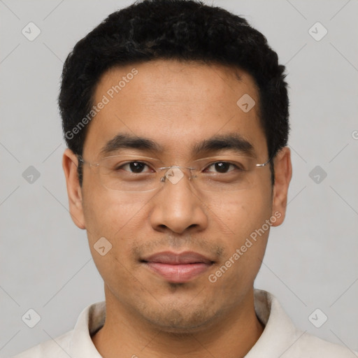 Joyful asian young-adult male with short  black hair and brown eyes