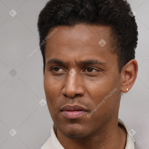Neutral latino young-adult male with short  black hair and brown eyes