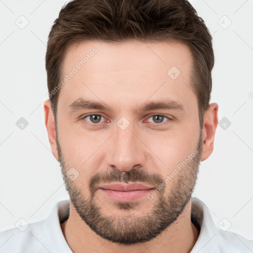 Joyful white young-adult male with short  brown hair and brown eyes