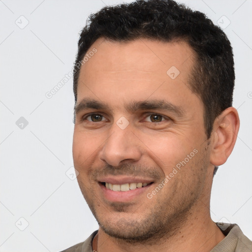 Joyful white young-adult male with short  brown hair and brown eyes