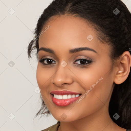 Joyful latino young-adult female with long  brown hair and brown eyes