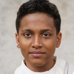 Joyful black young-adult male with short  brown hair and brown eyes