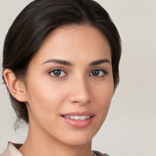 Joyful white young-adult female with medium  brown hair and brown eyes