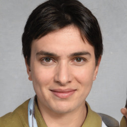 Joyful white young-adult male with medium  brown hair and brown eyes