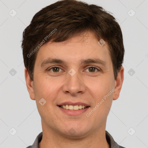 Joyful white young-adult male with short  brown hair and grey eyes