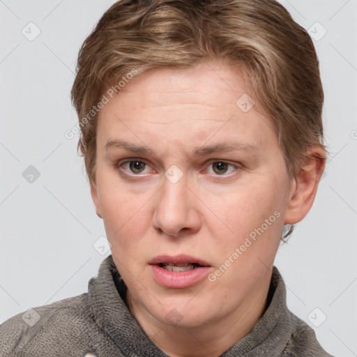 Joyful white adult female with short  brown hair and grey eyes