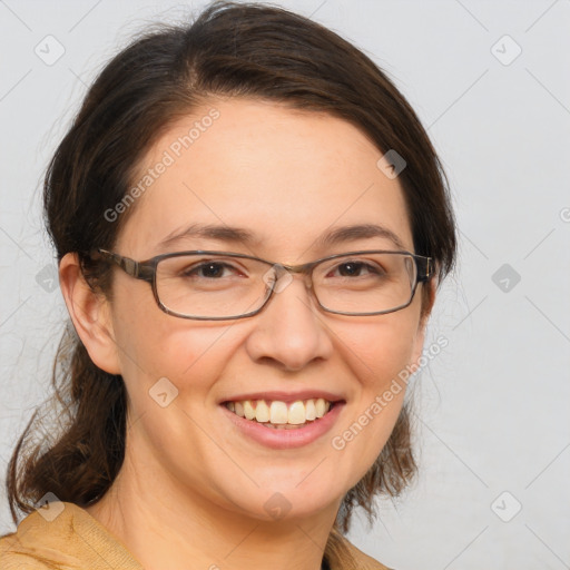 Joyful white adult female with medium  brown hair and brown eyes