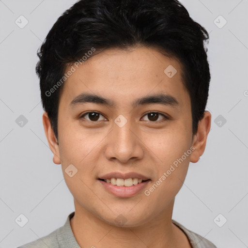 Joyful asian young-adult male with short  black hair and brown eyes