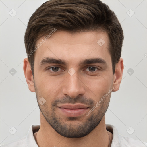 Joyful white young-adult male with short  brown hair and brown eyes