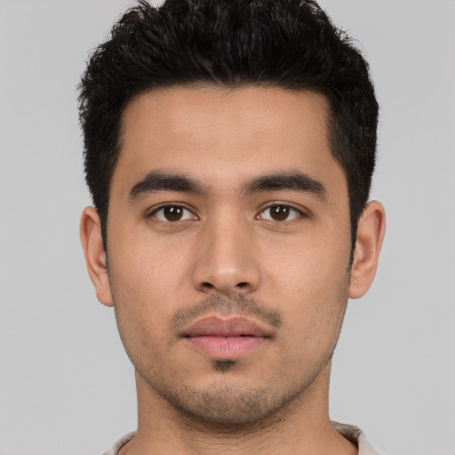 Neutral latino young-adult male with short  black hair and brown eyes