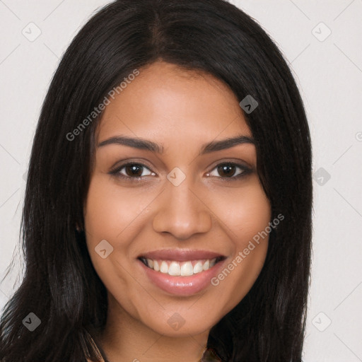 Joyful latino young-adult female with long  black hair and brown eyes