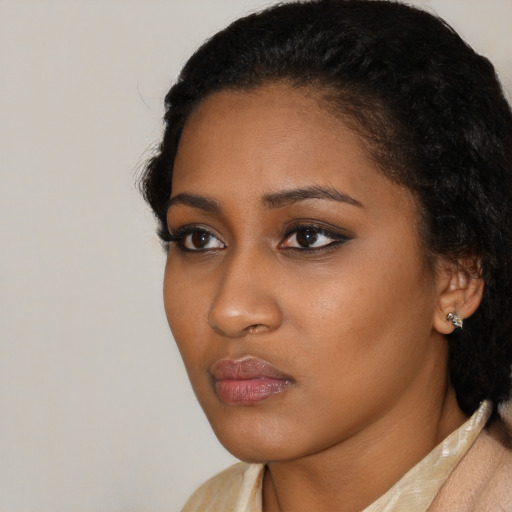 Neutral black young-adult female with medium  black hair and brown eyes