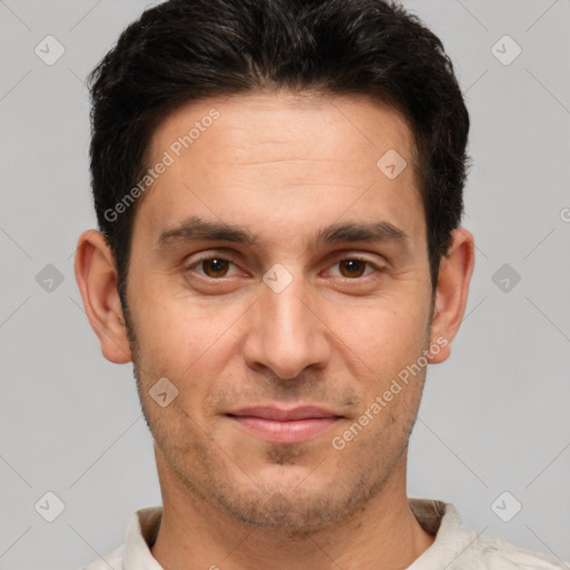 Joyful white adult male with short  brown hair and brown eyes