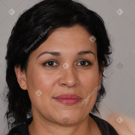 Joyful latino adult female with medium  brown hair and brown eyes