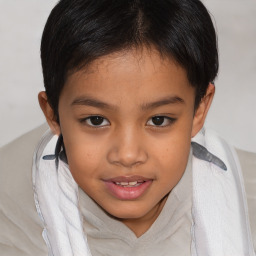 Joyful asian child female with short  brown hair and brown eyes