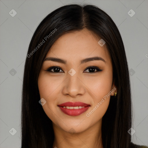 Joyful latino young-adult female with long  brown hair and brown eyes