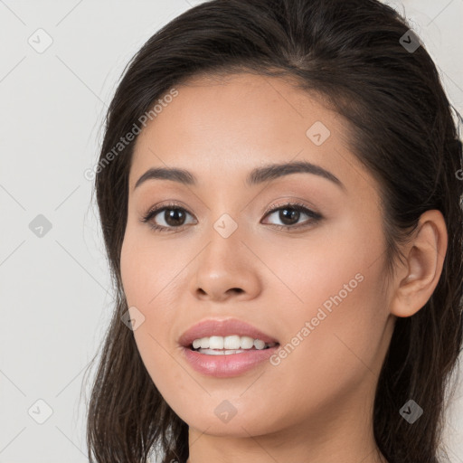 Joyful white young-adult female with long  brown hair and brown eyes