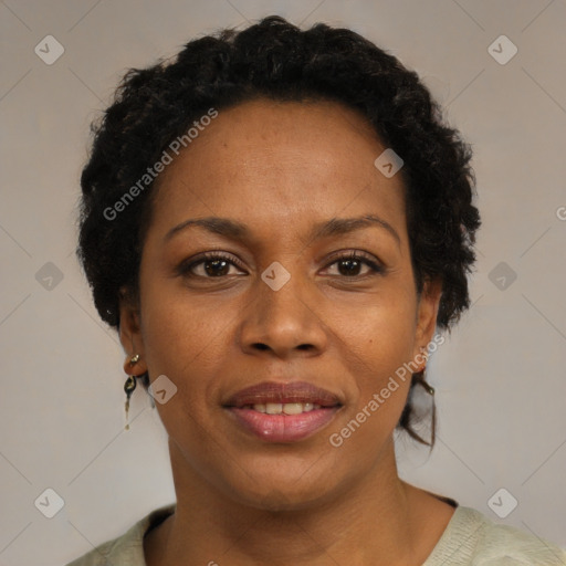 Joyful black adult female with short  brown hair and brown eyes