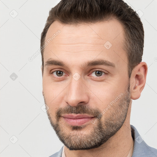 Joyful white young-adult male with short  brown hair and brown eyes