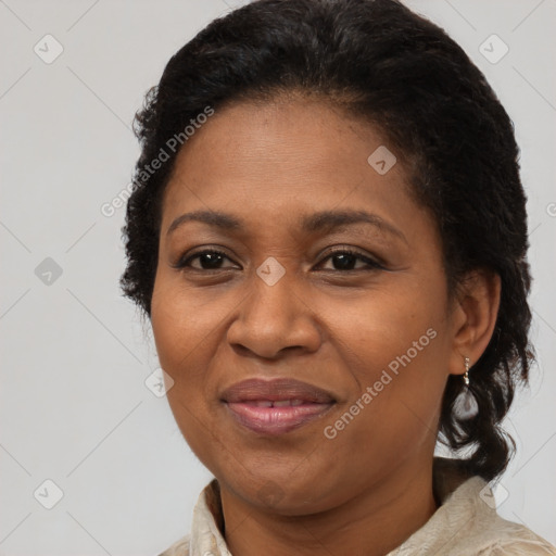 Joyful black adult female with medium  brown hair and brown eyes