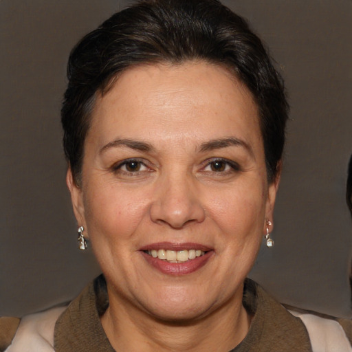 Joyful white adult female with short  brown hair and brown eyes