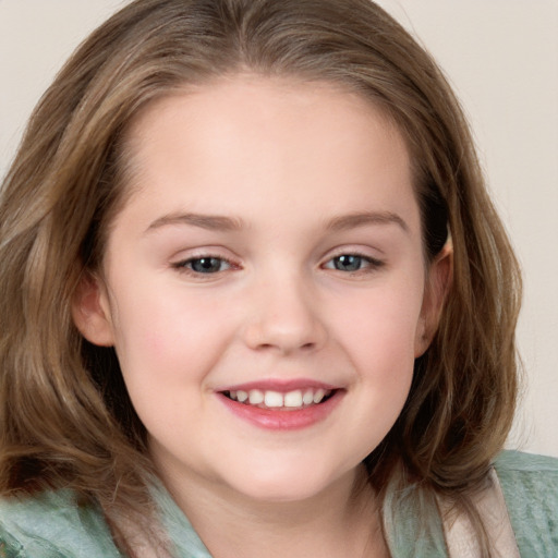 Joyful white child female with medium  brown hair and grey eyes