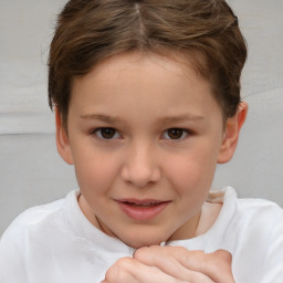 Joyful white child female with short  brown hair and brown eyes