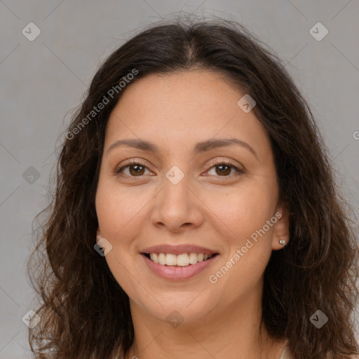 Joyful white adult female with long  brown hair and brown eyes