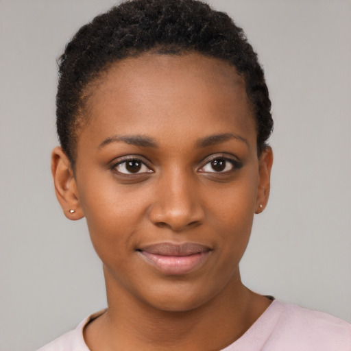 Joyful black young-adult female with short  brown hair and brown eyes