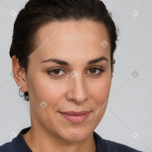 Joyful white adult female with short  brown hair and brown eyes