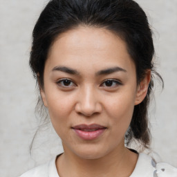 Joyful asian young-adult female with medium  brown hair and brown eyes