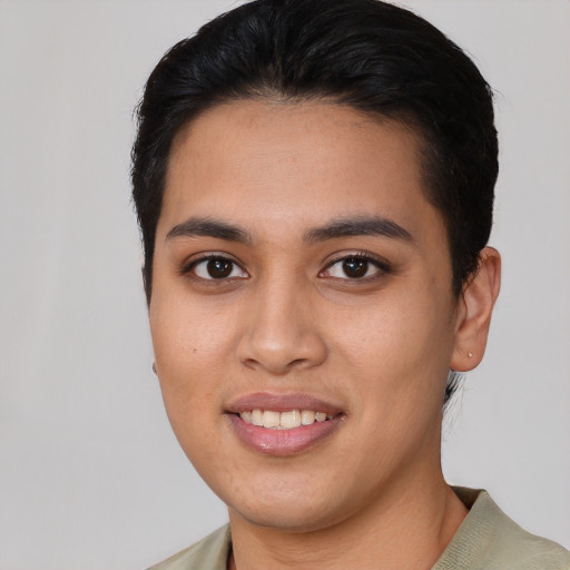 Joyful asian young-adult female with short  black hair and brown eyes