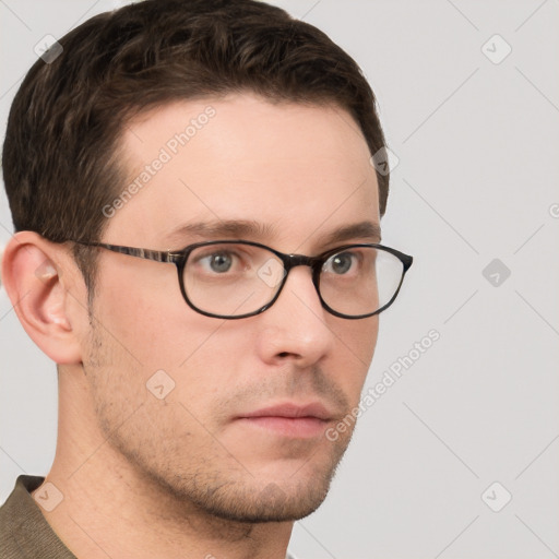 Neutral white young-adult male with short  brown hair and grey eyes