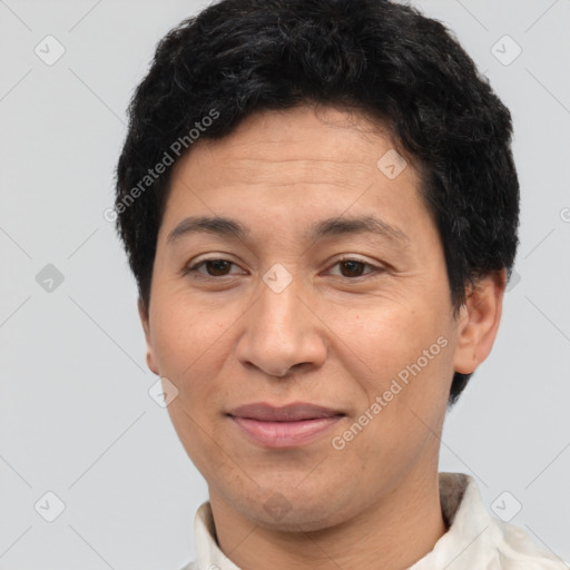 Joyful latino adult male with short  black hair and brown eyes